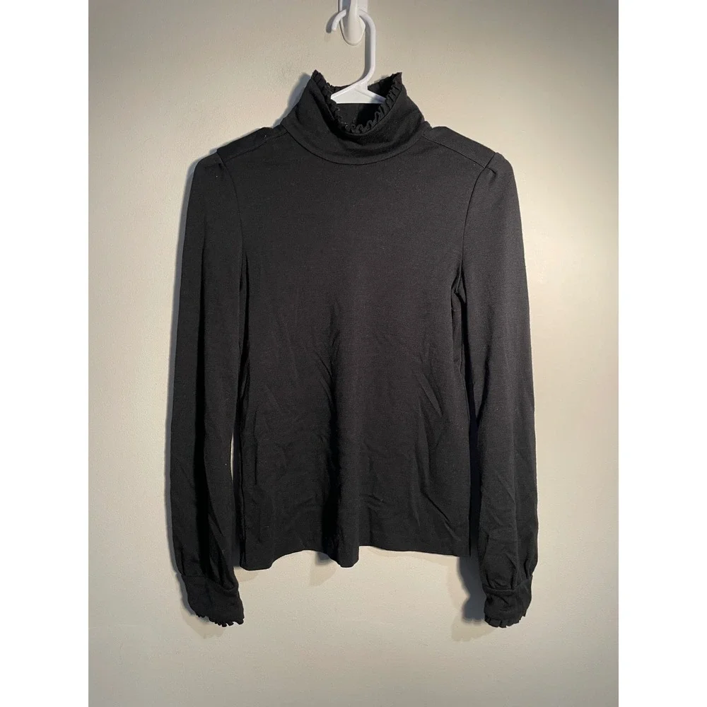 Diane von Furstenberg Black Wool Turtleneck Ruffle Hem Top Size 10 Quiet Luxury